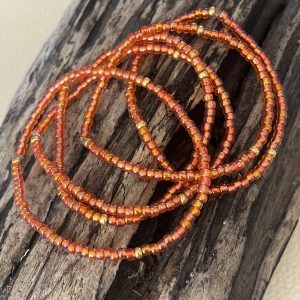 Bracelet élastique OREA en perles de verre japonaise MIYUKI orange reflets lumineux brillant et doré fait main