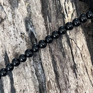 Bracelet en pierre naturelle de coquillage petites perles onyx et acier inoxydable sans nickel sans plomb et sans cadmium, avec fermoir et chainette d'extension